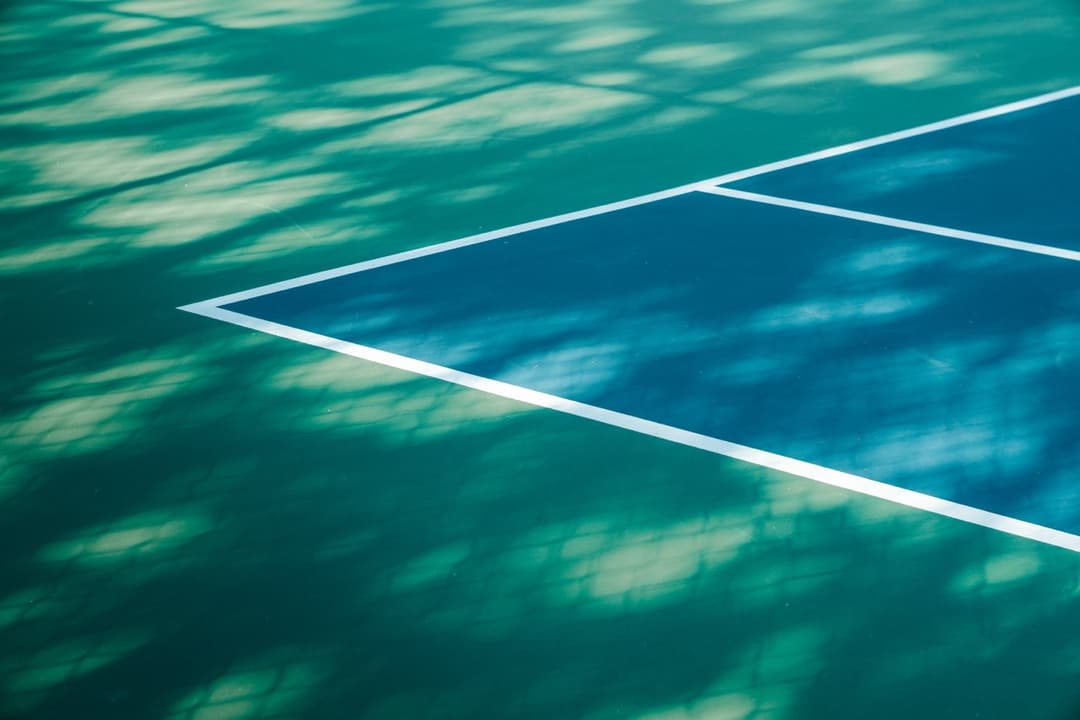 Abstract geometric pattern of swimming pool lane lines in turquoise water