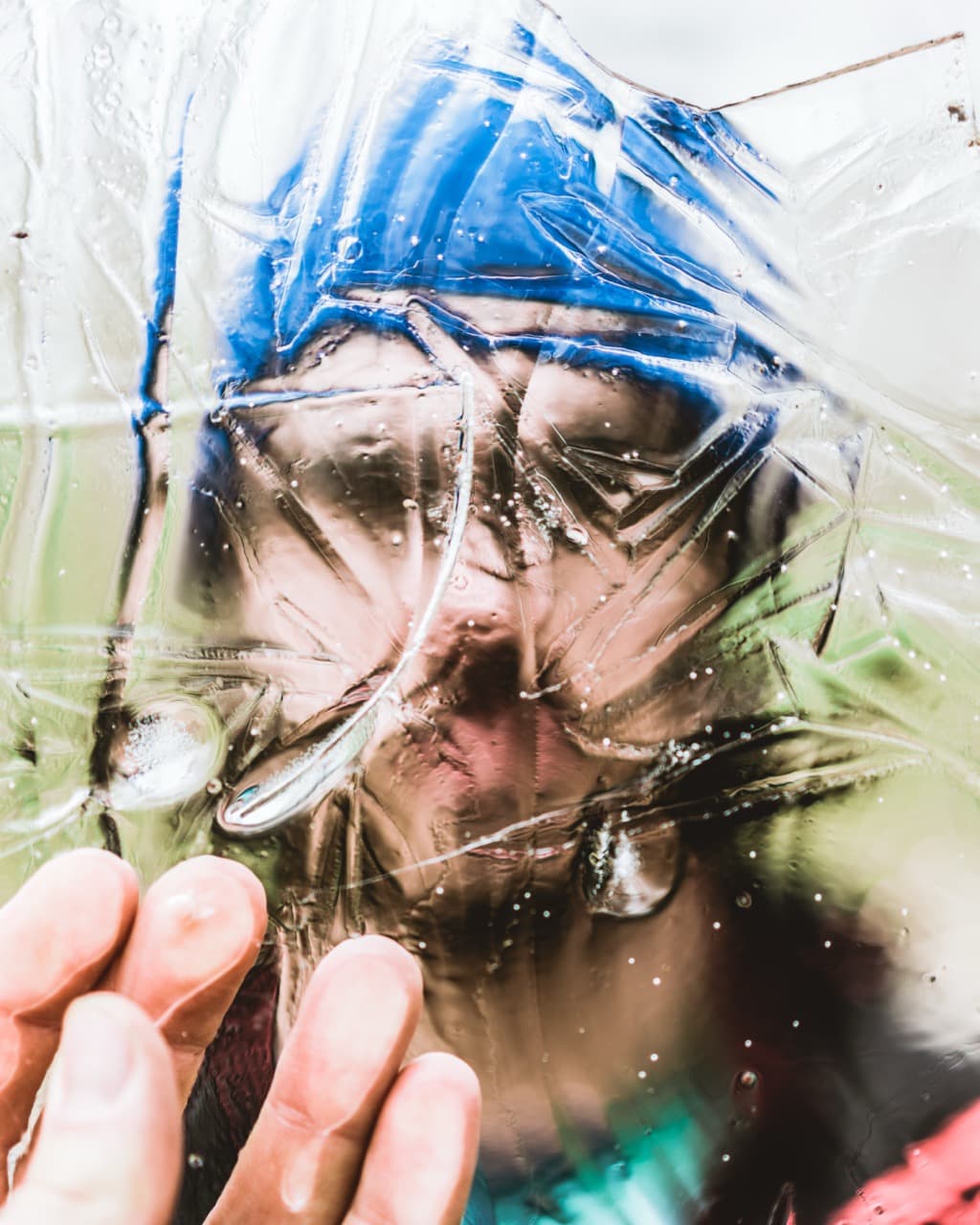 Abstract portrait of a person with a plastic wrap, creative portrait photography