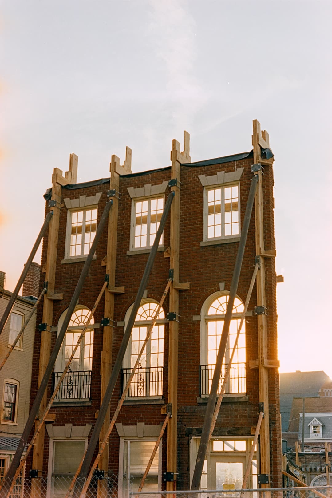 Unique architecture of a building with arched windows, Amsterdam canal house