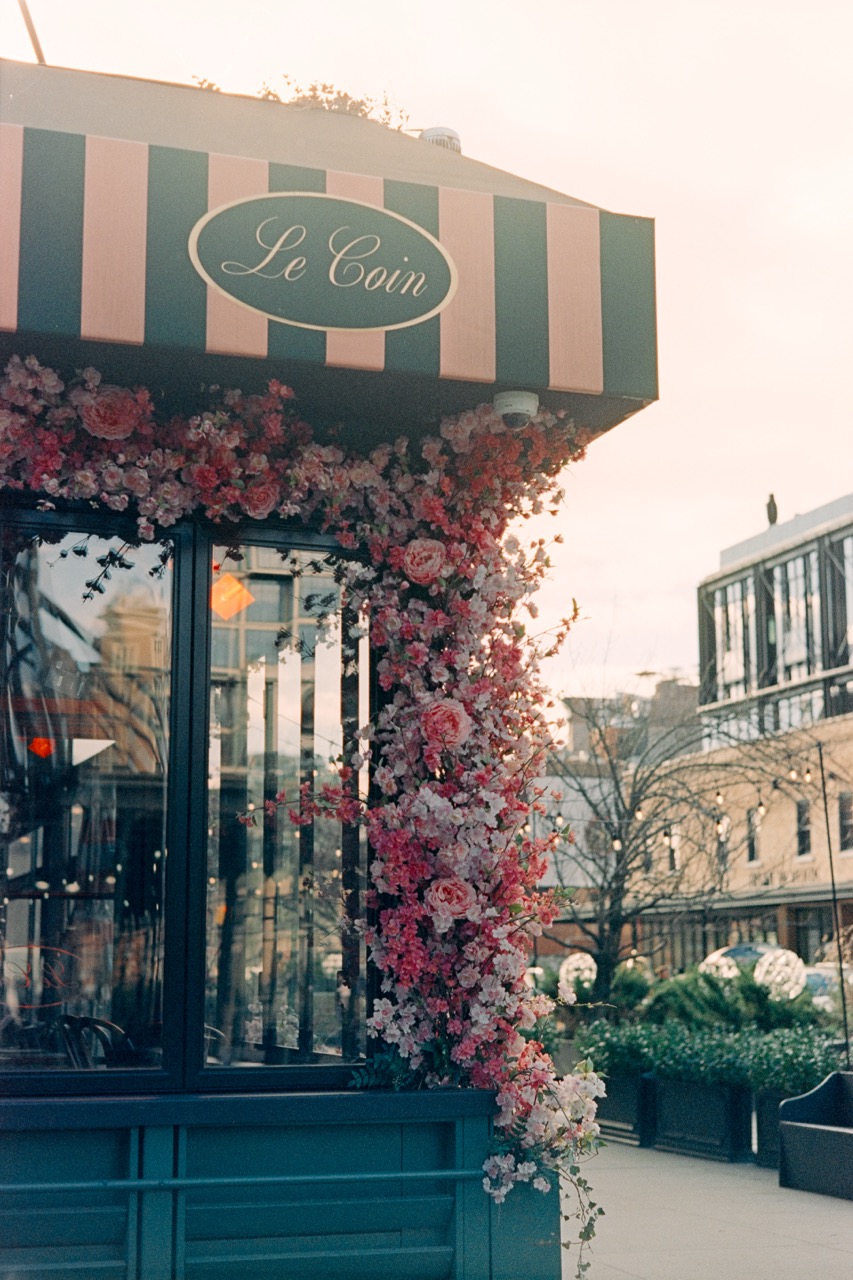 Le Cou cafe storefront with cherry blossom decorations