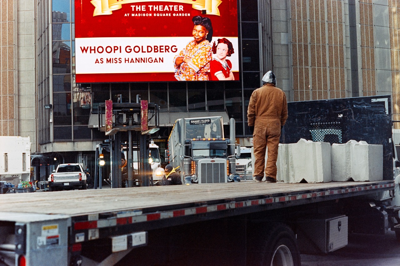 Theater district billboard featuring show advertisement